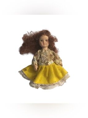 Miniature Porcelain Girl Doll in Yellow Dress and Brown Curly Hair